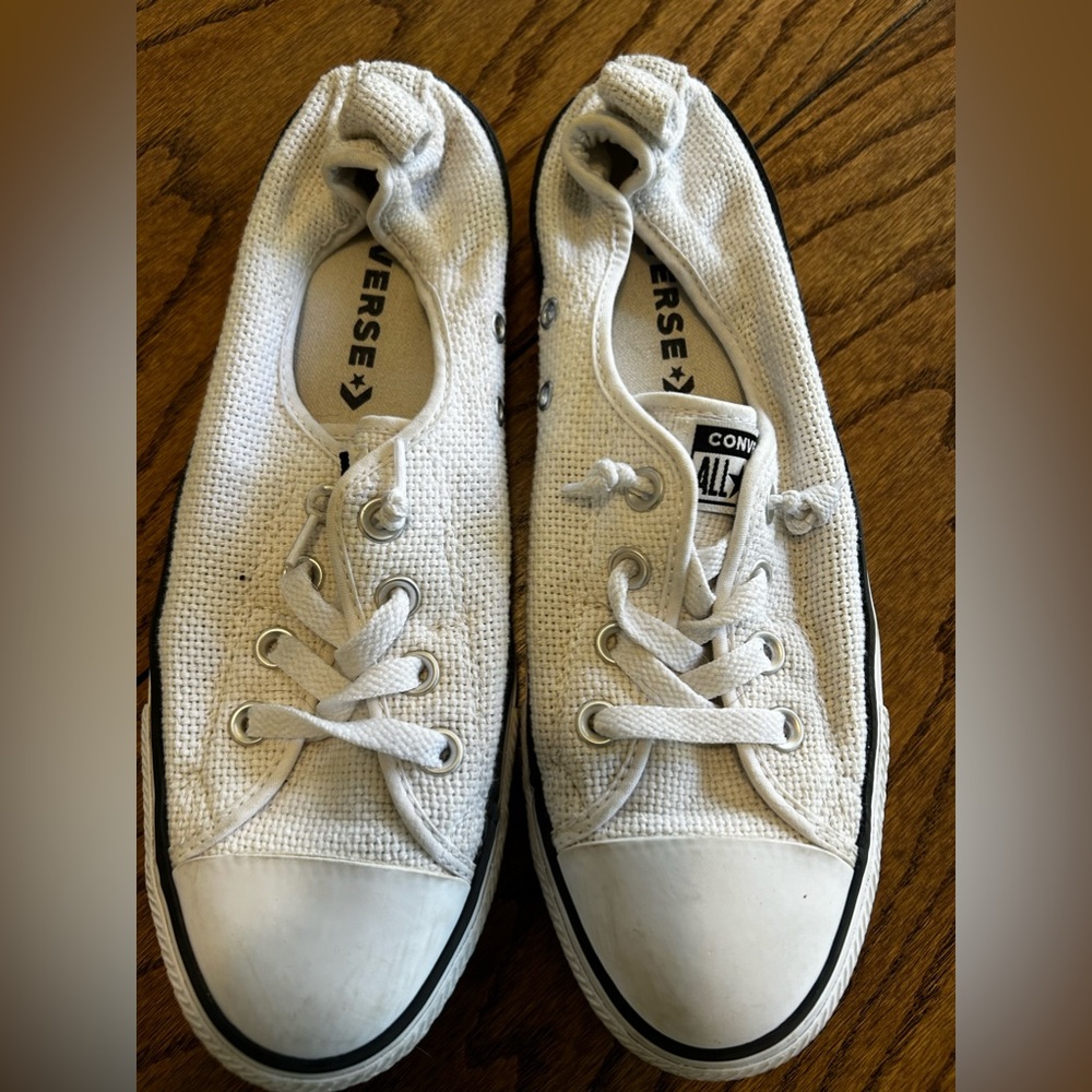 Converse shoes, no tie.